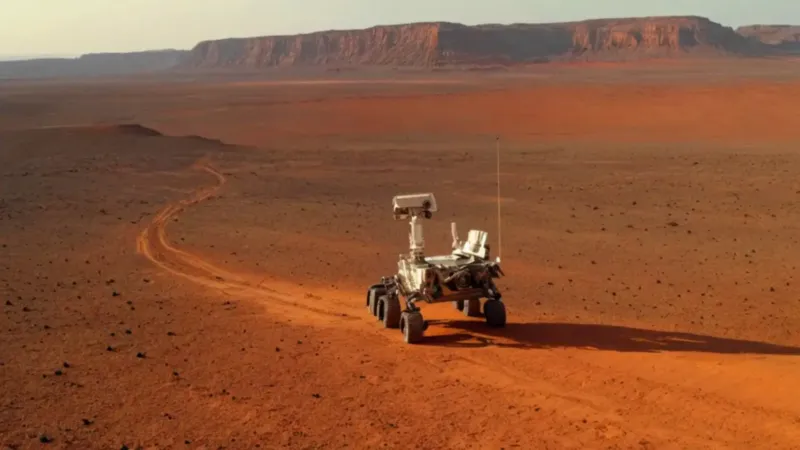 Astronauta y rover en un mundo rojo
